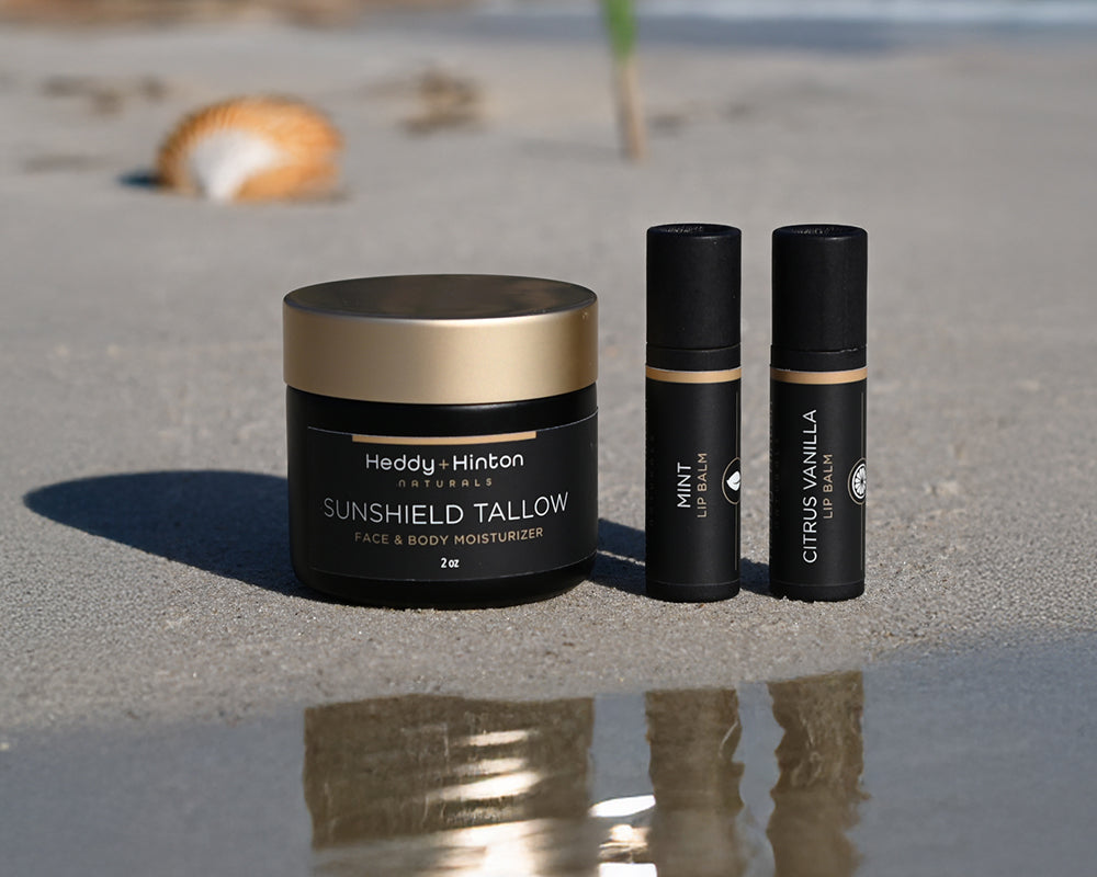 Picture of Heddy Hinton Beef Tallow Sunscreen Products on the Beach